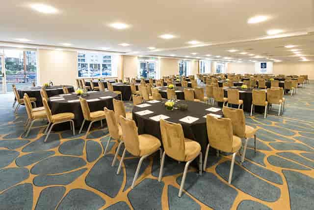 Grand Room 3 at Chelsea Harbour Hotel, elegant meeting space with round tables for conferences.
