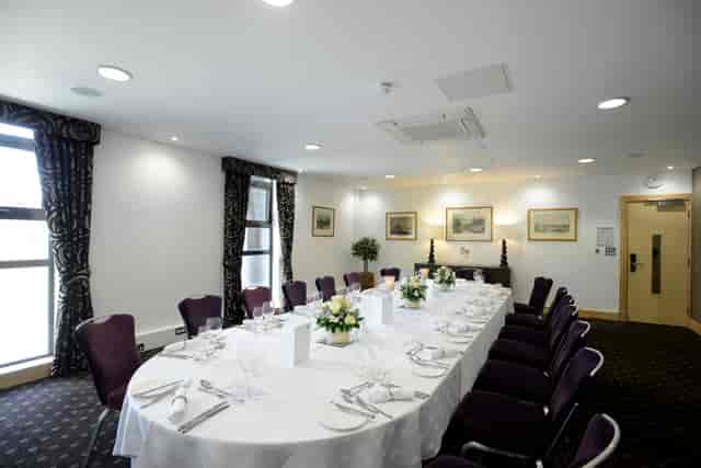 Elegant Lloyd Room meeting space with floral decor for corporate events.