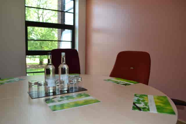 Syndicate Rooms at The Lensbury: round table meeting space with natural light.