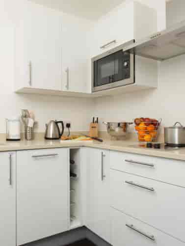 Modern kitchen in Staybridge Suites Birmingham, ideal for meetings and events.