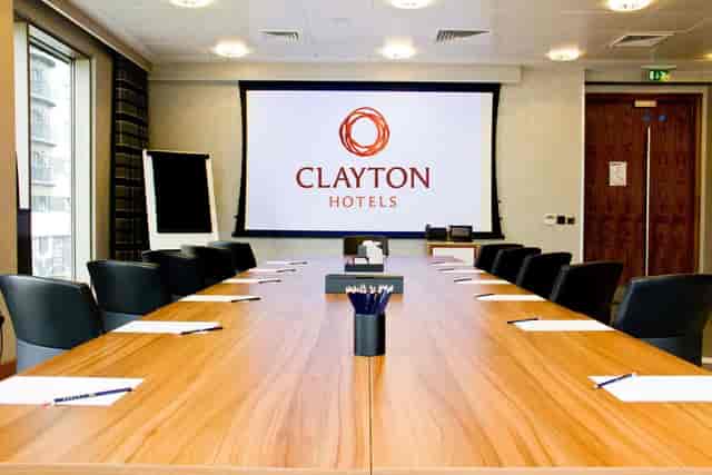 Meeting Room 9 at Clayton Hotel Birmingham with wooden table, ideal for corporate meetings.