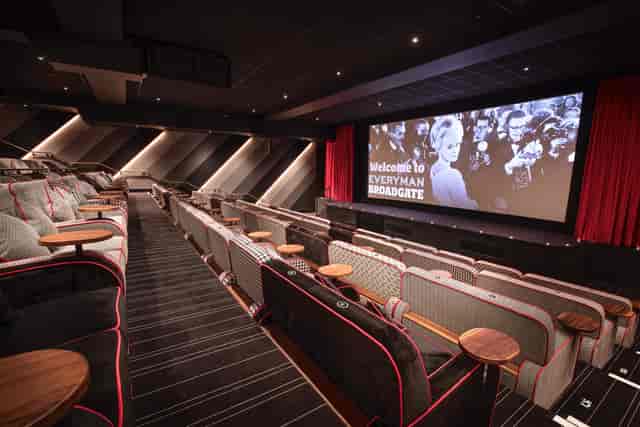 Modern cinema auditorium with plush seating, ideal for corporate events and film screenings.