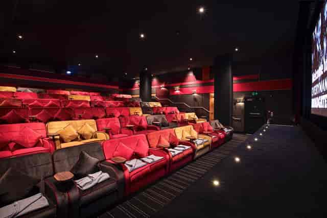 Modern cinema auditorium with plush seating, ideal for corporate events and screenings.