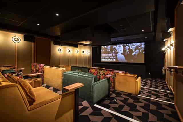 Sophisticated private screening room with cozy seating for corporate events at Everyman Broadgate.
