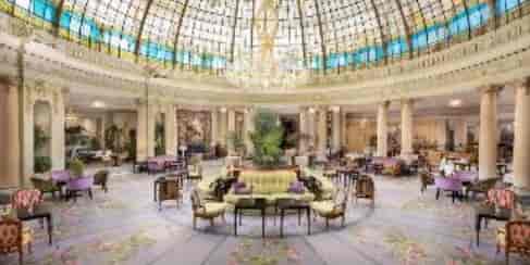 Hotel Westin Palace event space with glass-domed ceiling, perfect for upscale conferences and gatherings.