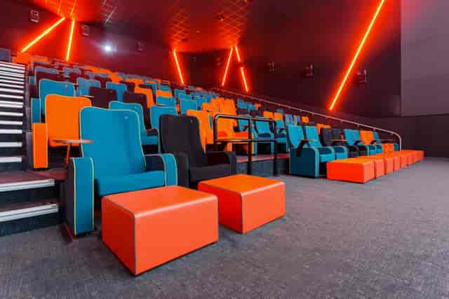 Modern auditorium with vibrant seating for conferences and film screenings in Stockport.