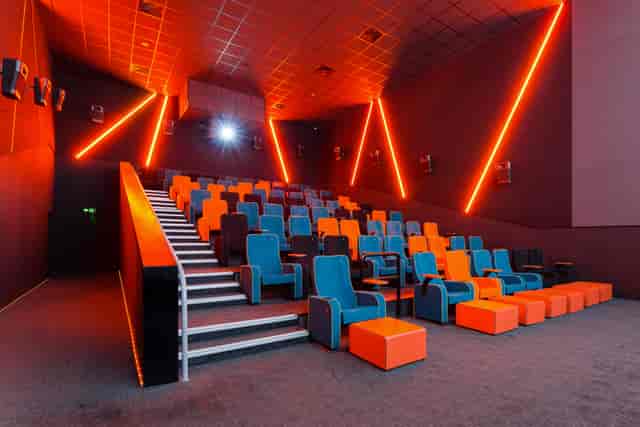 Modern cinema auditorium with vibrant seating, ideal for film screenings and events.