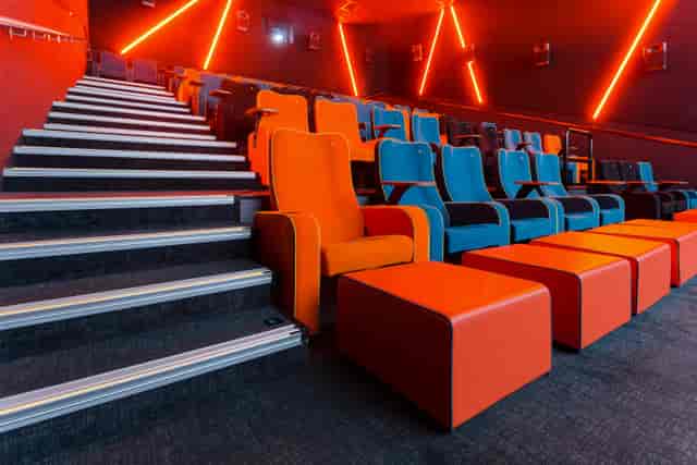 Modern auditorium with vibrant seating in The Light Cinema Stockport for film screenings.