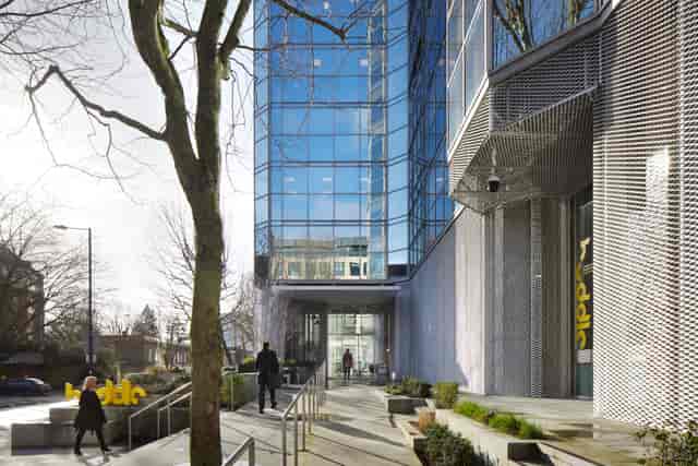 Modern glass entrance of Huddle venue, perfect for professional meetings and events.