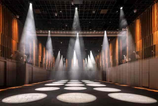 Ballroom at The Londoner with dramatic lighting, ideal for conferences and galas.