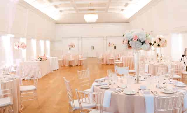 Elegant Lord Stanley Ballroom with floral centerpieces, ideal for weddings and upscale events.