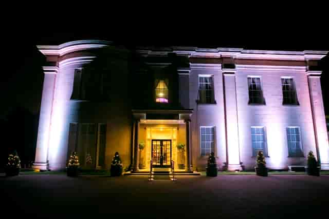 Elegant venue with strategic lighting, perfect for upscale receptions and gala dinners.