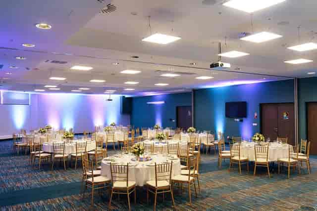 Elegant ballroom with round tables, perfect for receptions and banquets in Riga.