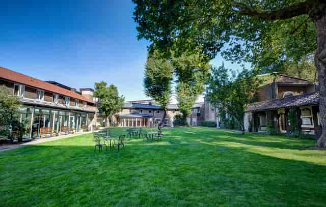 Spacious outdoor event venue at The Royal Foundation of St. Katharine with lush lawns.
