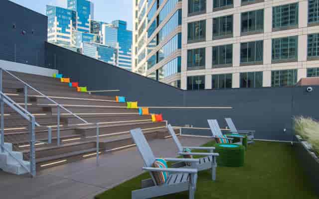 Outdoor event space with tiered seating, ideal for networking and team-building activities.