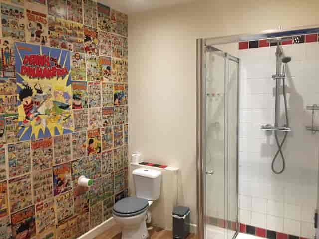 Vibrant comic-themed restroom in Koa Tree, ideal for creative event branding.