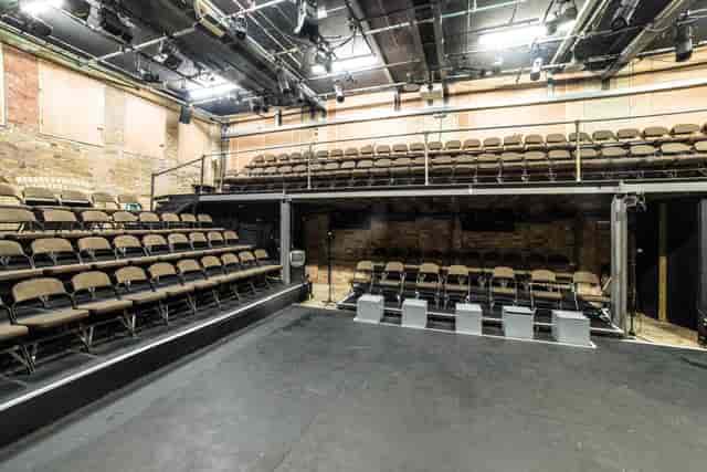 Versatile Arcola Theatre Studio 1 with tiered seating for intimate events and performances.