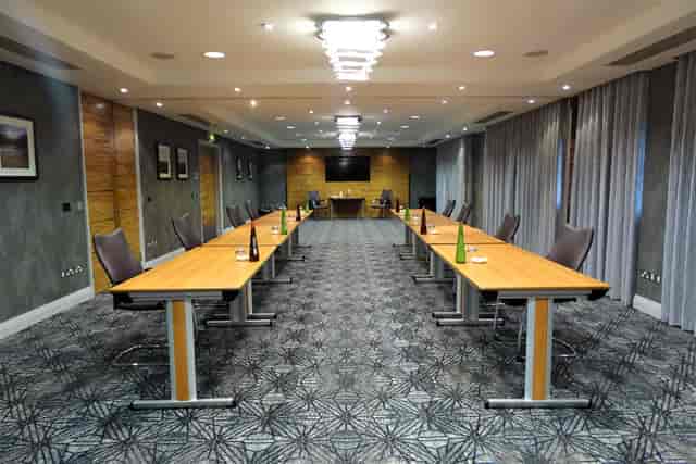 Wybunbury meeting room at Rookery Hall, U-shaped tables for professional events.