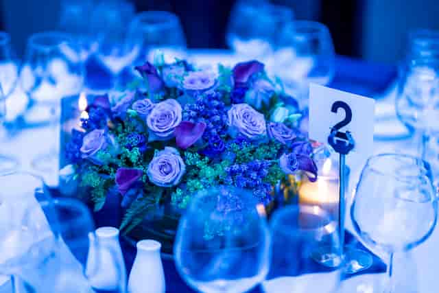 Elegant dining table with floral centerpiece at Woburn Suite, University of London venue.