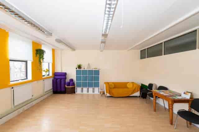 Versatile meeting space with natural light for workshops and gatherings at St. Margaret's House.