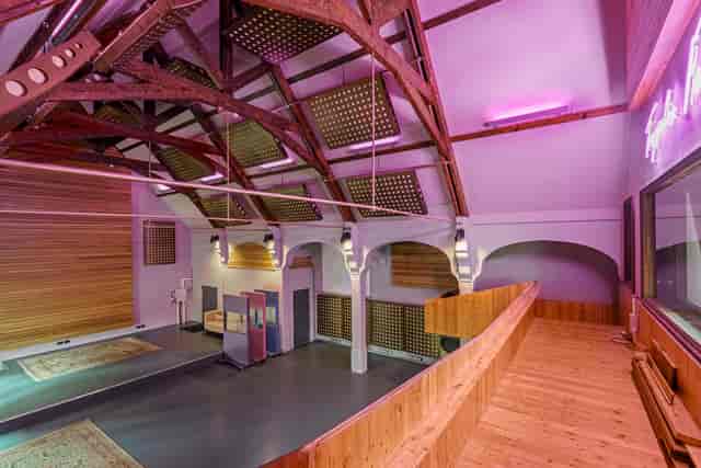 Versatile event space with high ceilings at The Empire Broadcasting Corporation for corporate events.