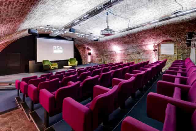 Filming event at RSA House with tiered seating and unique brick archway.