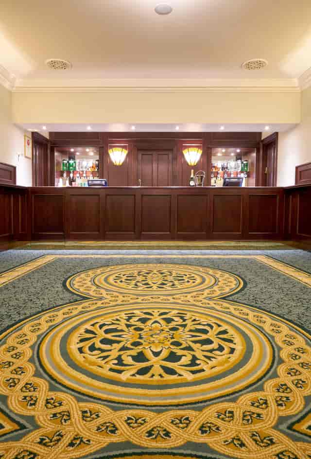 Aldwych Theatre Auditorium with elegant bar, ideal for upscale events and gatherings.
