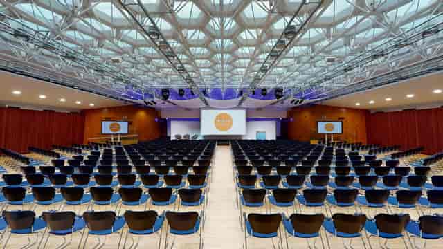 Congress Hall theater setup with architectural ceiling for large-scale keynotes and plenary sessions.