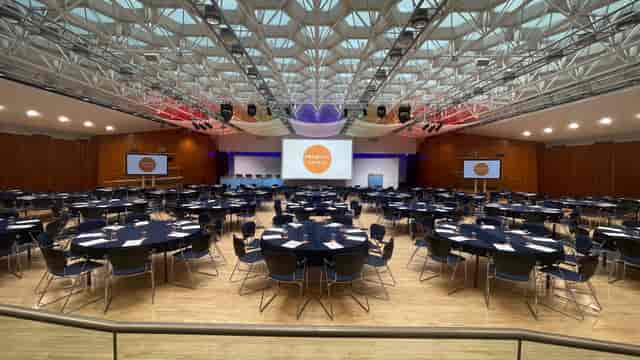 Congress Hall plenary space with modern ceiling design for corporate summit and gala events.
