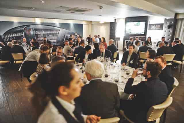 Boardroom at Selhurst Park Stadium for corporate dinner event with round-table setup.