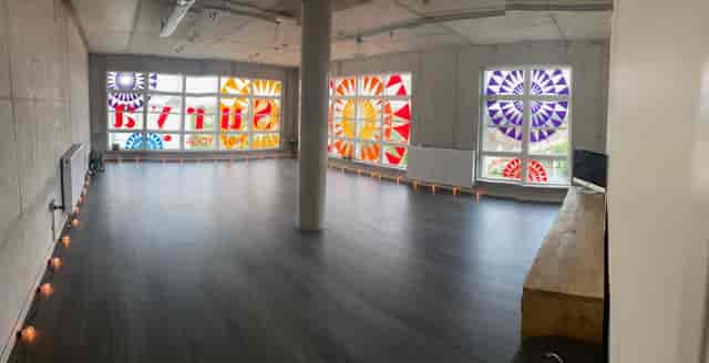 Surya Studio 2 with stained glass windows, perfect for workshops and meetings.