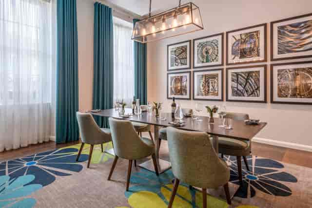 Stylish meeting room with large table and natural light at Courtyard by Marriott Edinburgh.