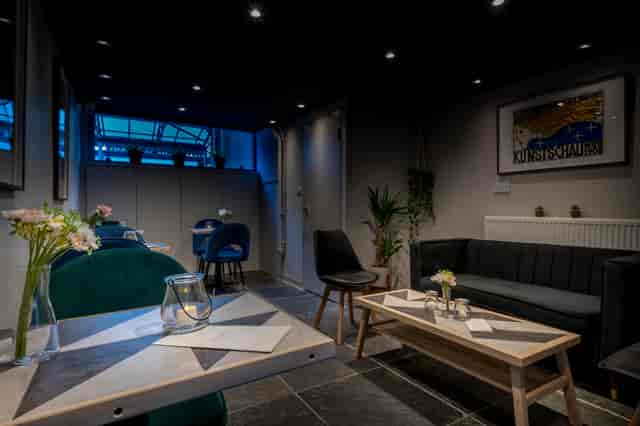 Modern Frequency Cocktail Bar with soft lighting, perfect for intimate gatherings and workshops.