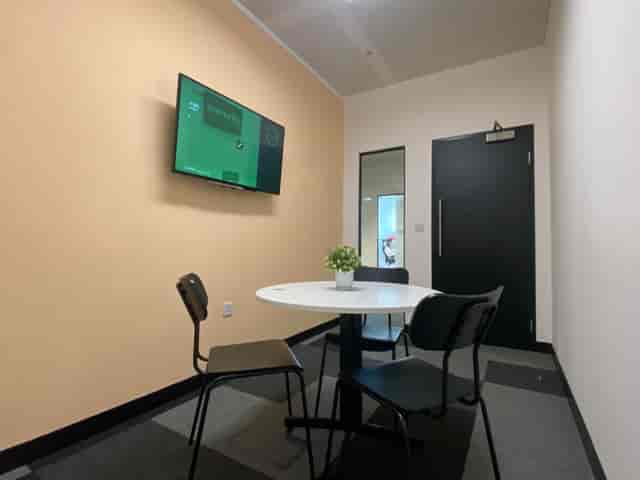 Small meeting room with round table for brainstorming at Avenue HQ St Paul's Square.