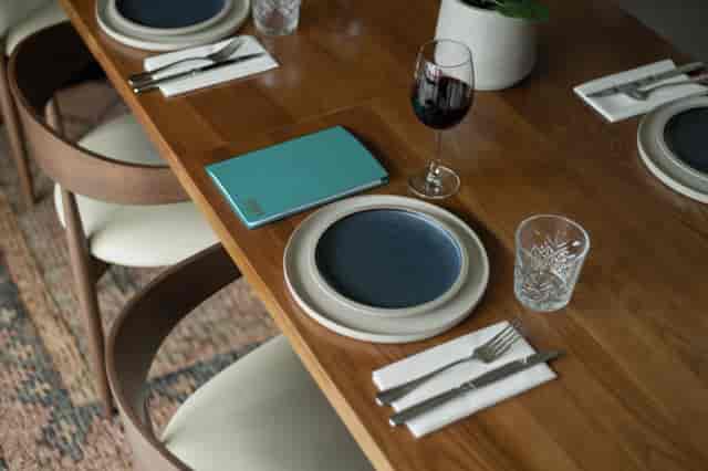 Private dining room with elegant table setting for upscale meetings and events.