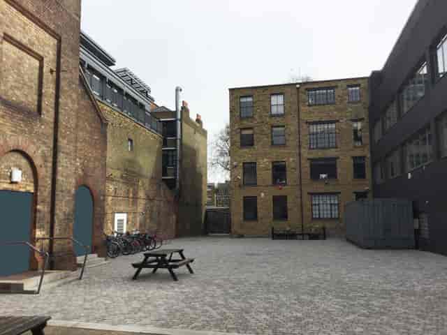 Courtyard in Shoreditch Electric, rustic brick backdrop for casual gatherings and events.