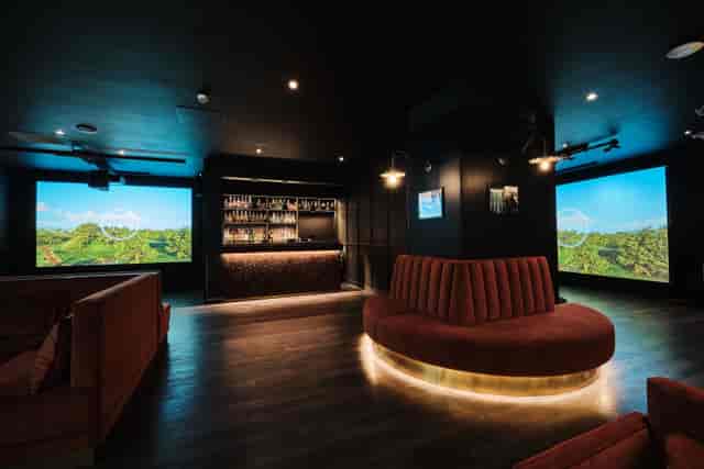 Modern event space with bar and projection screens for corporate events in Moorgate.