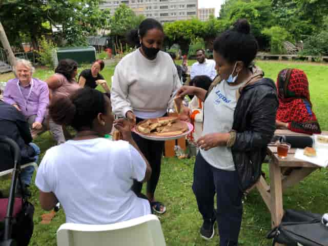 Vibrant outdoor gathering at The Garden, showcasing community engagement and catering.
