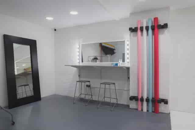 Event preparation area with vanity mirror, ideal for makeup and photo shoots.