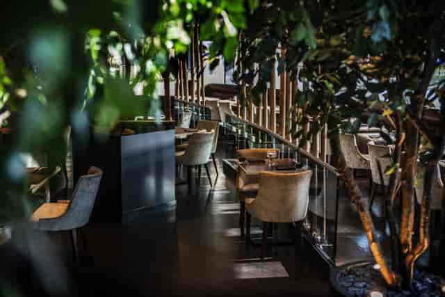 Stylish restaurant lounge with modern decor, ideal for intimate events and networking.