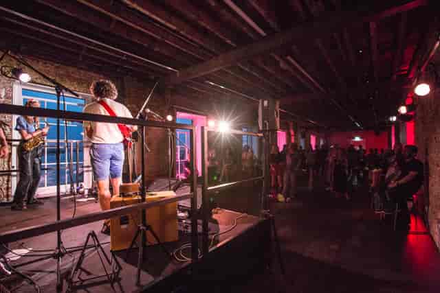 Live music performance at Beanfeast, Woolwich Works with vibrant atmosphere and engaged audience.
