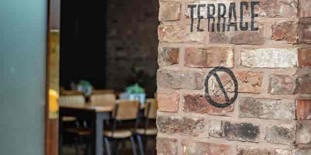 Terrace at Duke Street Market: rustic brick wall, ideal for events and gatherings.