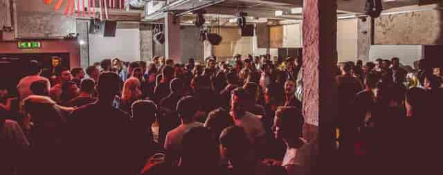 Vibrant crowd at 93 Feet East event, showcasing lively atmosphere for networking and entertainment.