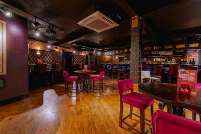 Bacardi Bar in Leeds: modern event space with pink seating, perfect for gatherings.