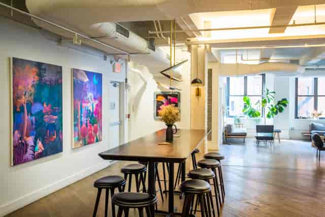 Modern meeting room with colorful artwork, ideal for creative brainstorming sessions.