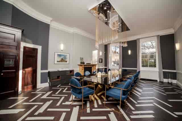 Sophisticated meeting room with elegant table, ideal for corporate events and discussions.