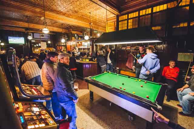Lively bar venue with pool table, perfect for networking and casual gatherings.