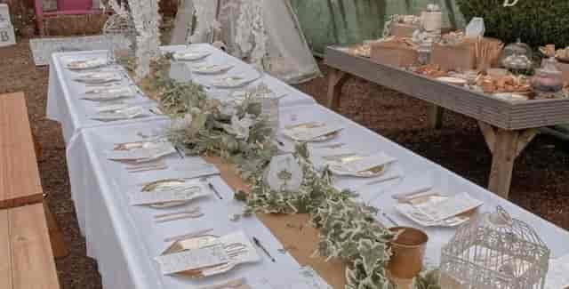Elegant dining table with gold accents at Secret Garden event space for weddings.