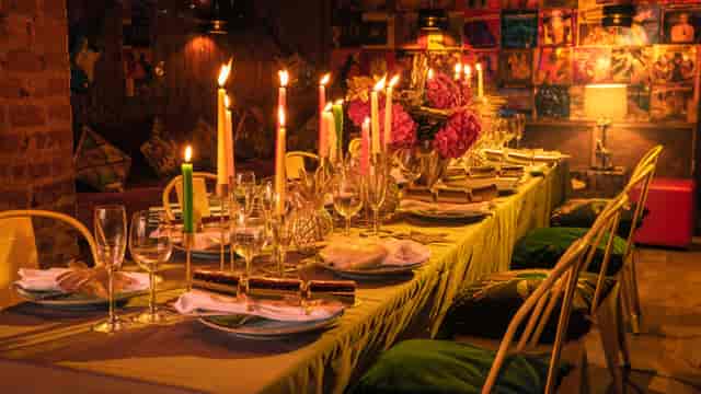 Elegant dining table with floral centerpiece for Christmas party venue hire.