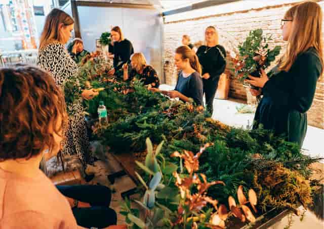 Vibrant wreath-making workshop at Columbia Creative for team-building events.